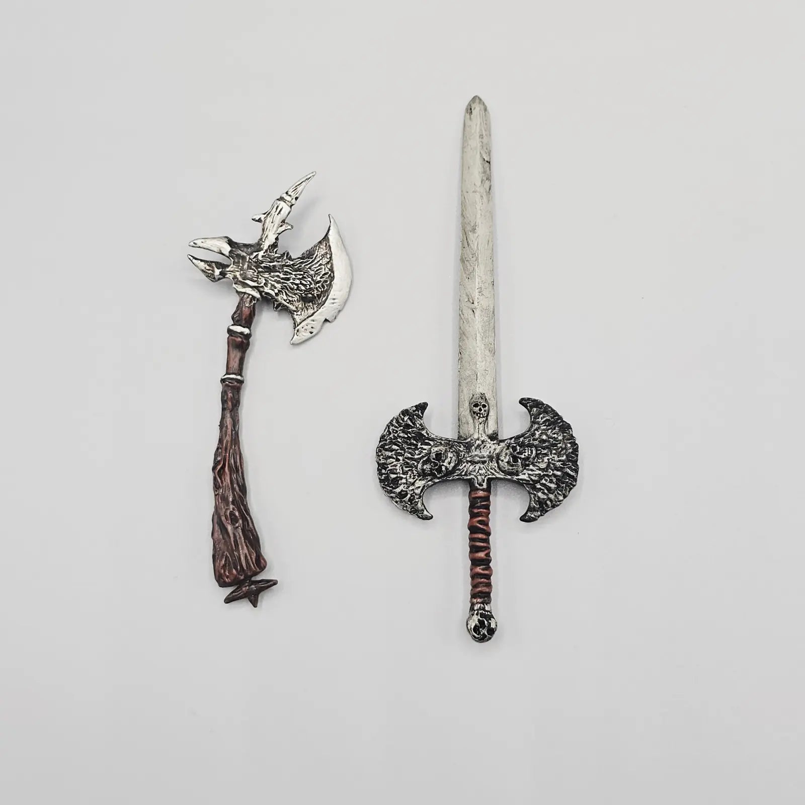 Sword and axe accessories for Chaos Comics 1999 Cremator action figure