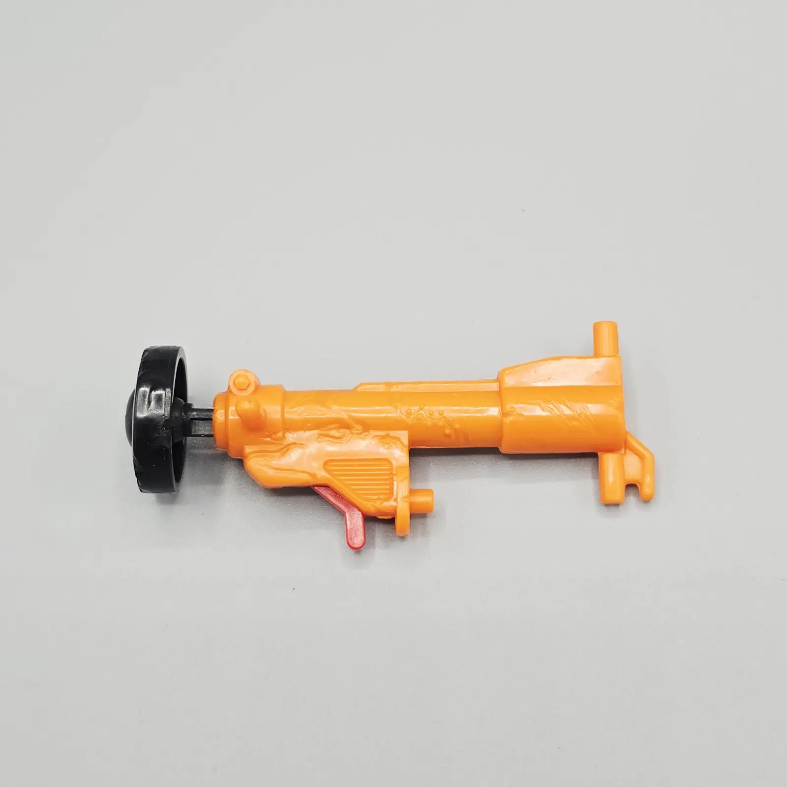 Orange ram weapon accessory for 1992 Crash Dummies Jack Hammer action figure