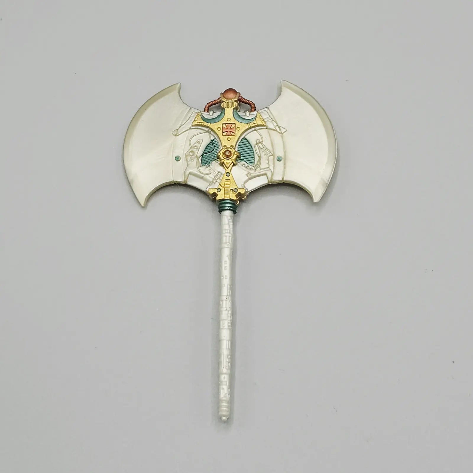 Decorative axe with a detailed head on a gray background