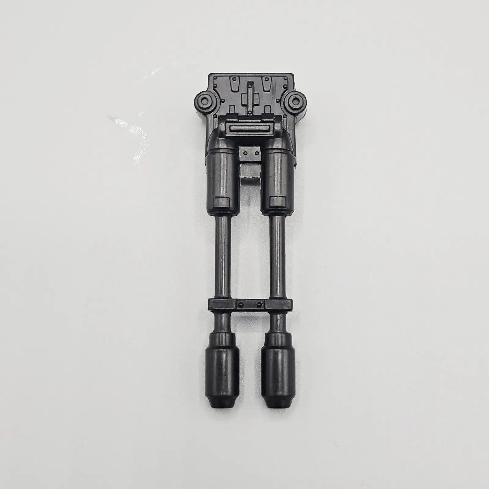 Action figure tank cannon part on grey background