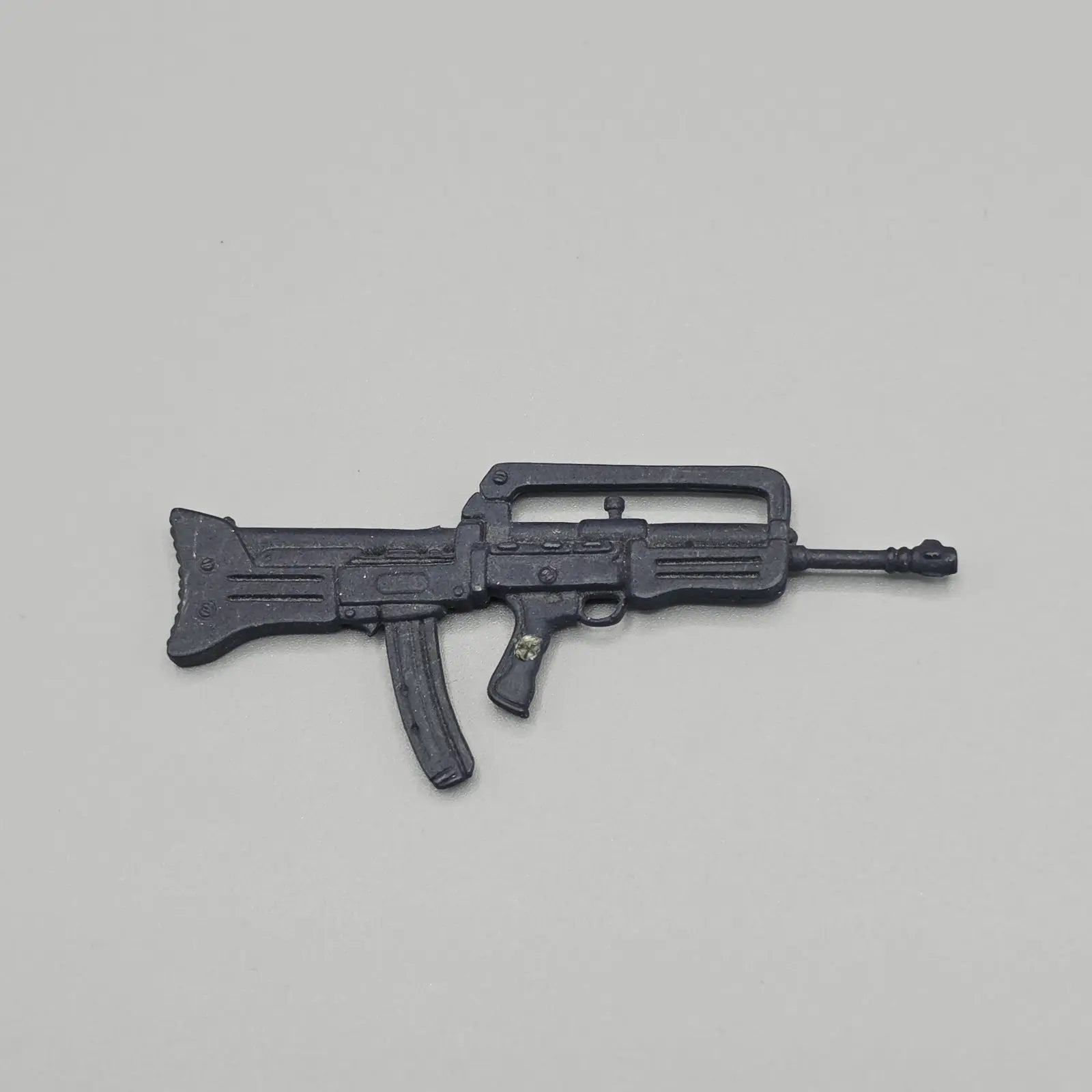 Toy rifle on a gray background