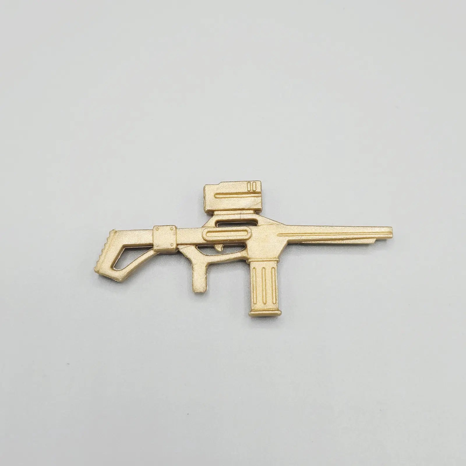 Gold rifle accessory for 1988 Kenner Robocop Headhunter action figure