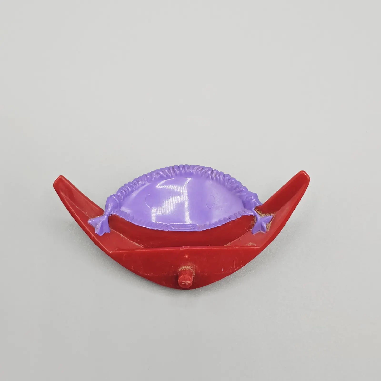 Red and purple windshield part for action figure scooter