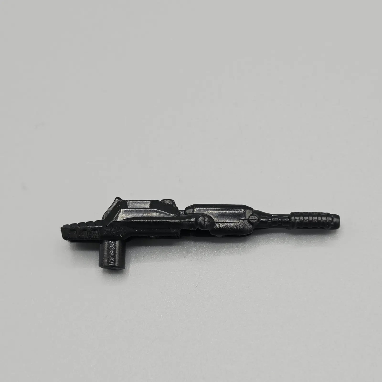 Black gun accessory for Transformers Topspin action figure