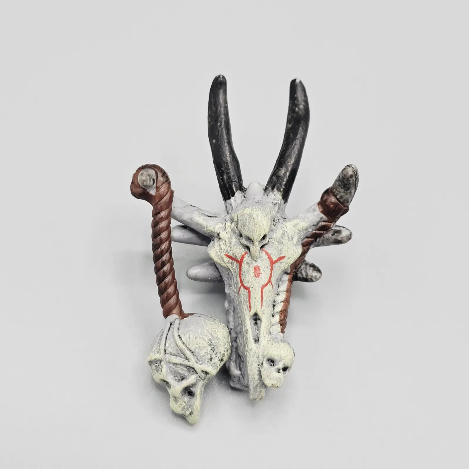 Decorative item with skull and antlers on a light gray background